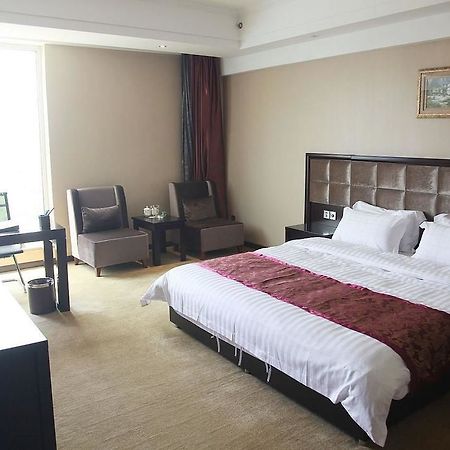 Weishi International Hotel Qing Zhou Extérieur photo