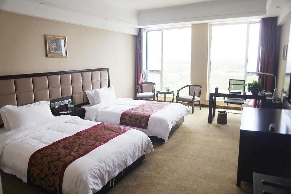 Weishi International Hotel Qing Zhou Extérieur photo