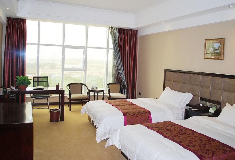 Weishi International Hotel Qing Zhou Extérieur photo