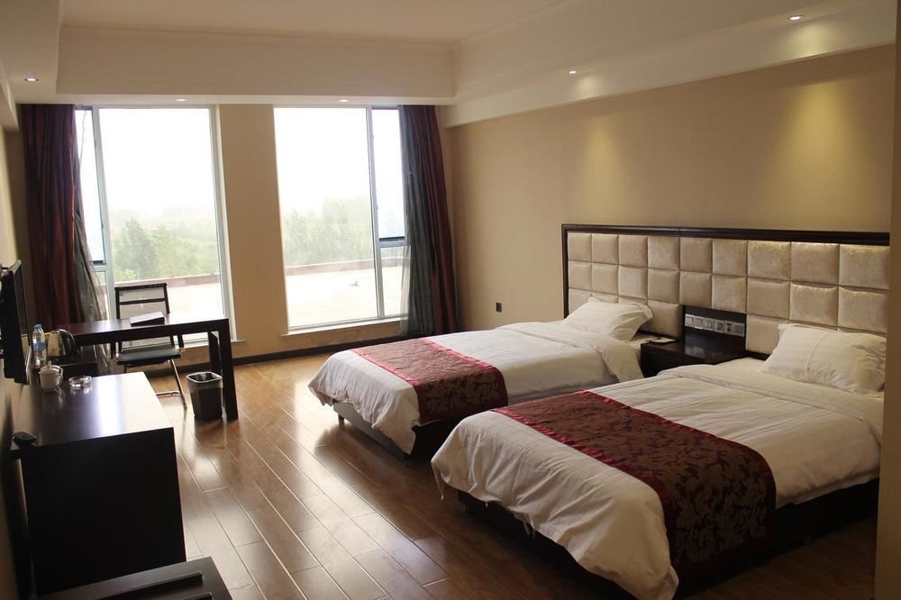 Weishi International Hotel Qing Zhou Extérieur photo