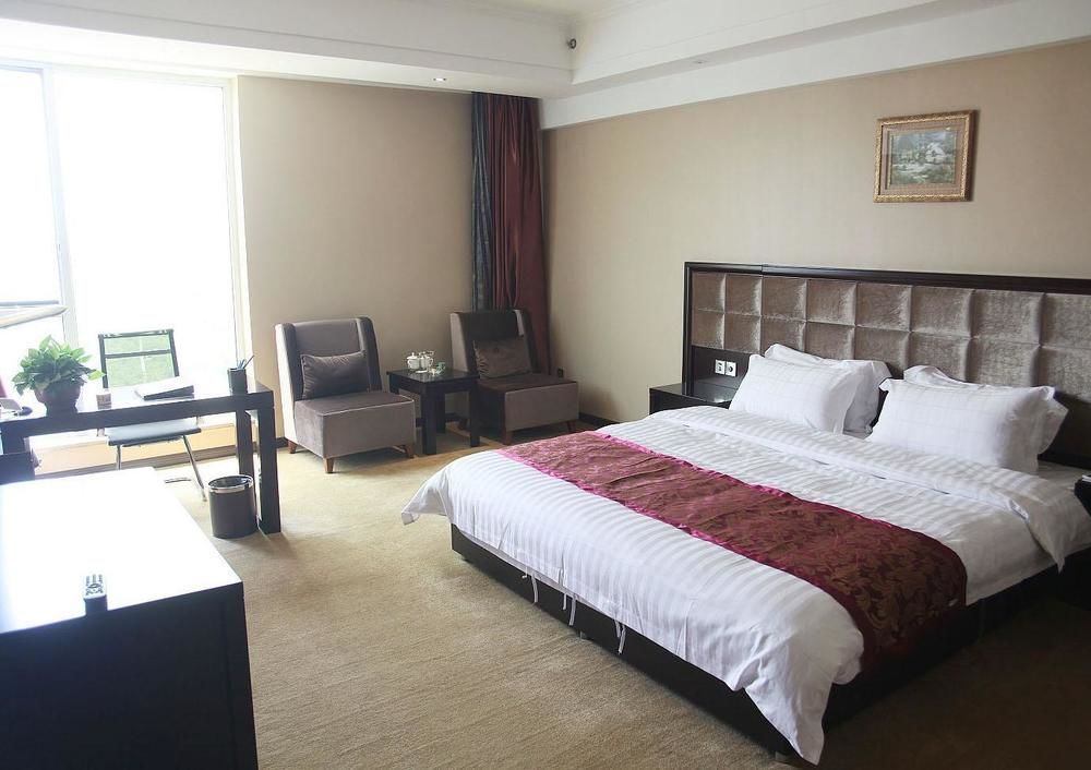 Weishi International Hotel Qing Zhou Extérieur photo