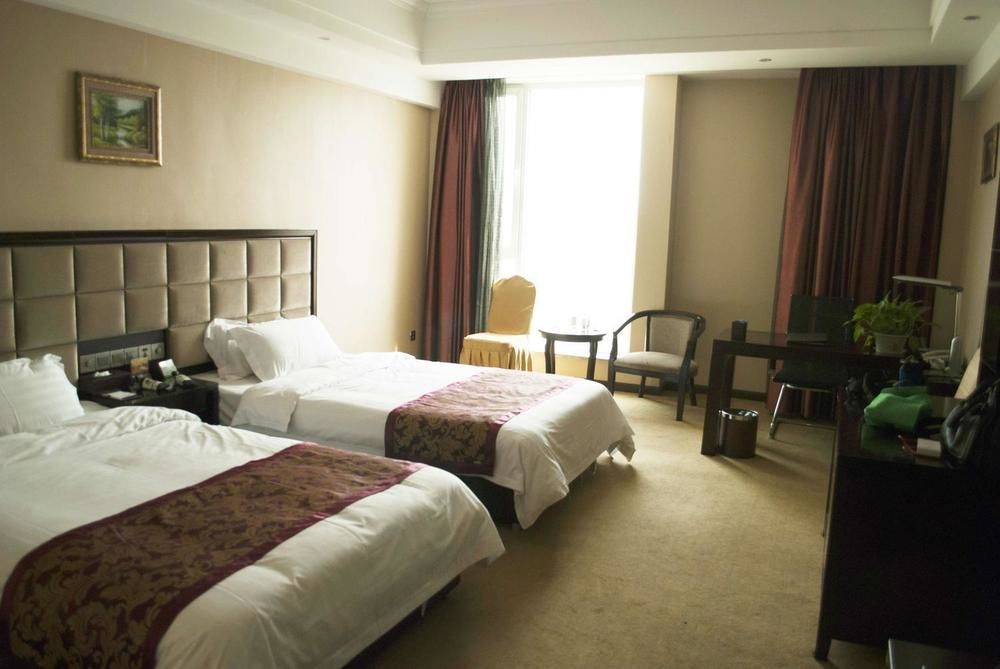 Weishi International Hotel Qing Zhou Extérieur photo